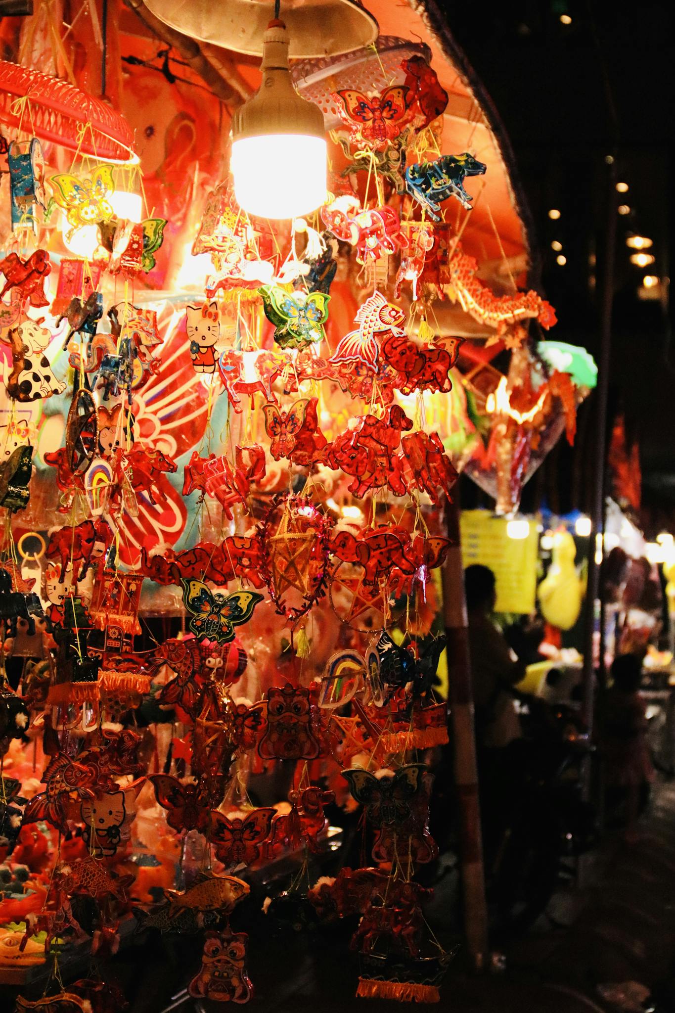 Colorful lanterns at a lively night market, capturing festive and traditional vibes.