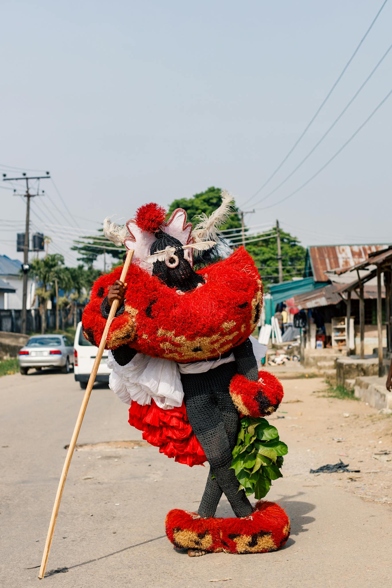 Vibrant masquerade performer in Calabar, Nigeria during cultural street festival.